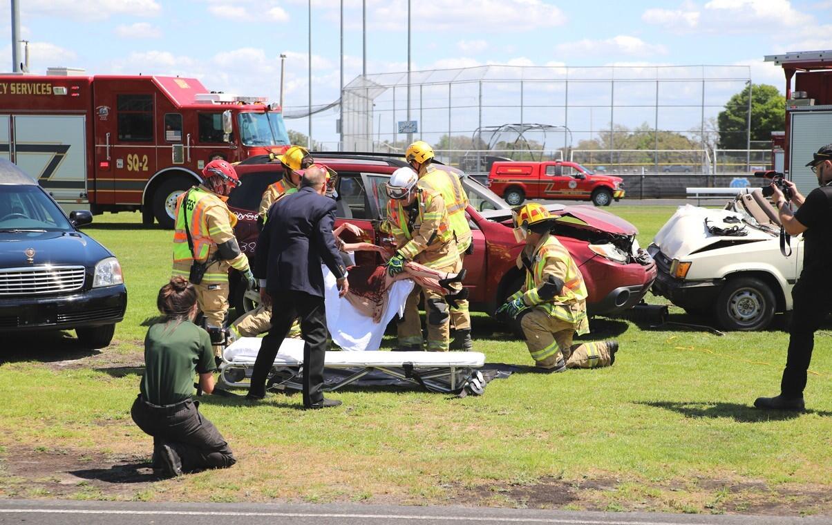 First responders at a staged auto accident