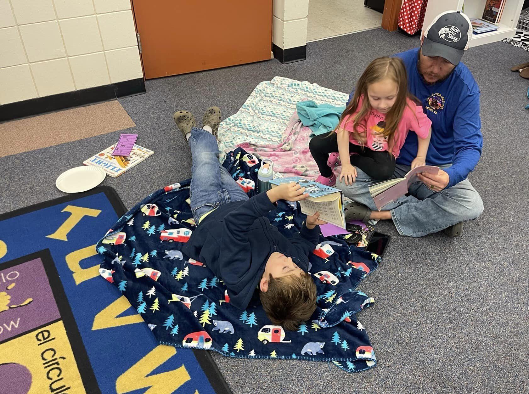 father reading with children