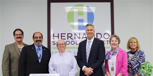Group photo of school board and superintendent