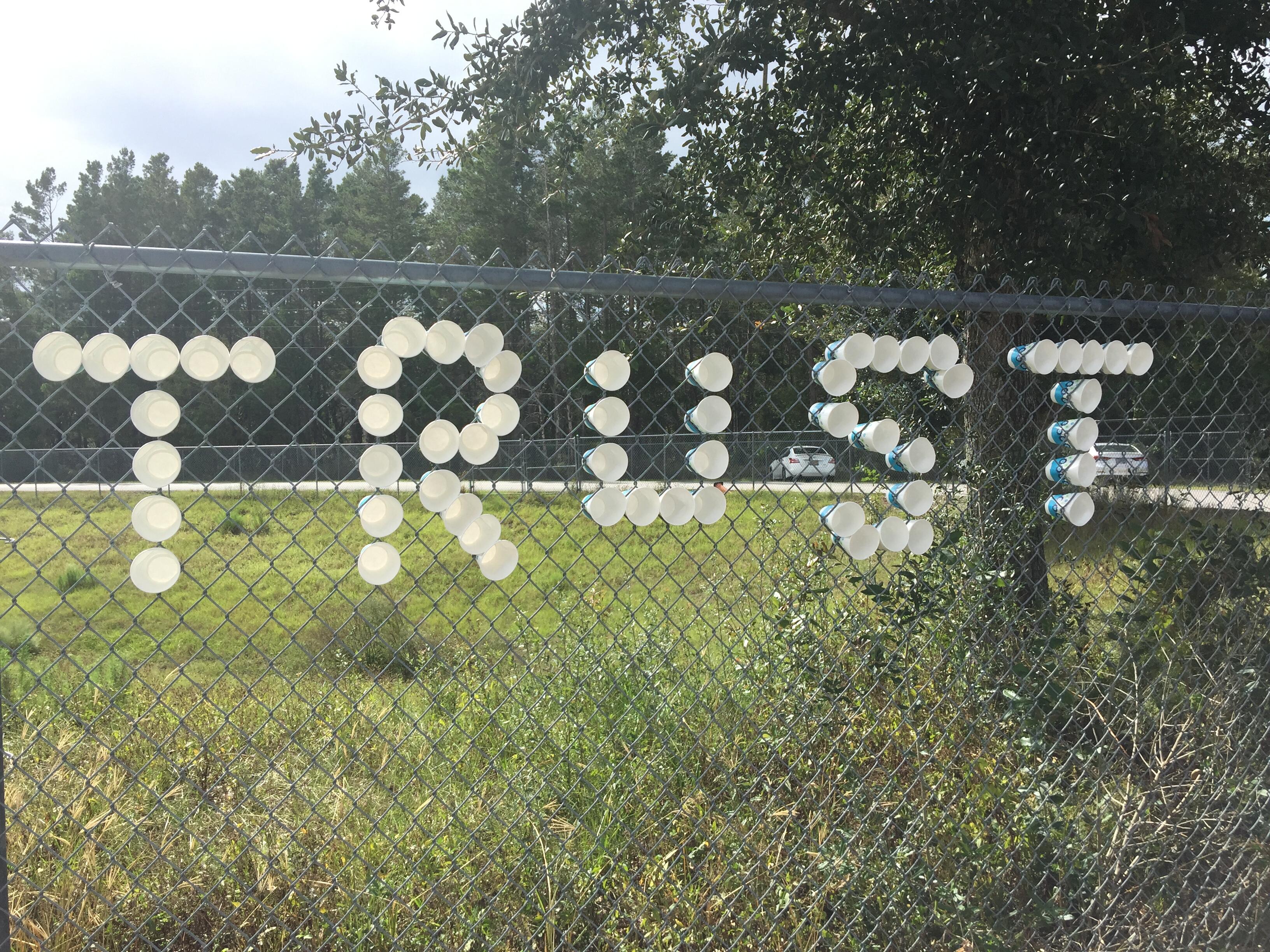 image of cups spelling out the word trust 