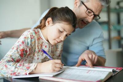 student and father doing homework